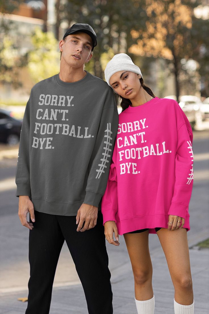 Welcome to Mask Couture By A.M, 🏈SORRY. CAN'T. FOOTBALL. BYE. (WITH SLEEVE DESIGN) ON OUR UNISEX SWEATSHIRTS.  🤩 WANT TO ADD A CUSTOM NAME TO 1 SLEEVE OR THE UPPER BACK OF THIS SWEATSHIRT???  BE SURE TO ADD THE ADD-ON 👇🏼 LISTING BELOW TO YOUR CART! 🤩 https://maskcouturebyam.etsy.com/listing/891811241/add-additional-text-change-design Makes A great Gift For Yourself And Your Football Loving Bestie  It's The PERFECT Football Lovers Sweatshirt To Cozy Up In Or Run Errands (BE SURE TO LET US KN Athletic Heather Long Sleeve T-shirt With Letter Print, Pink Varsity Tops For Game Day, Winter Athletic Heather Top With Graphic Print, Athletic Heather Crew Neck Top For Game Day, Long Sleeve T-shirt For Sports Events In Fall, Pink Crew Neck Sweatshirt For Sports Season, Fall Crew Neck Tops For Sports Events, Fall Long Sleeve T-shirt For Sports Events, Fall Long Sleeve Sports T-shirt