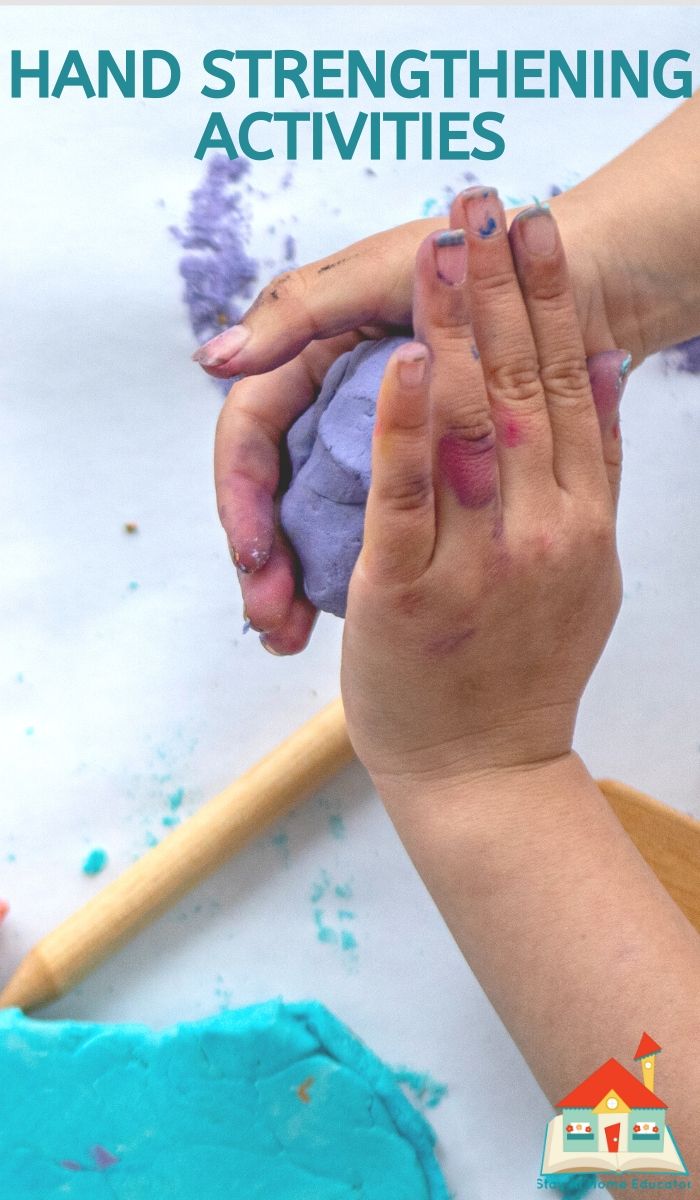 two hands are touching each other with blue and purple paint on the table behind them