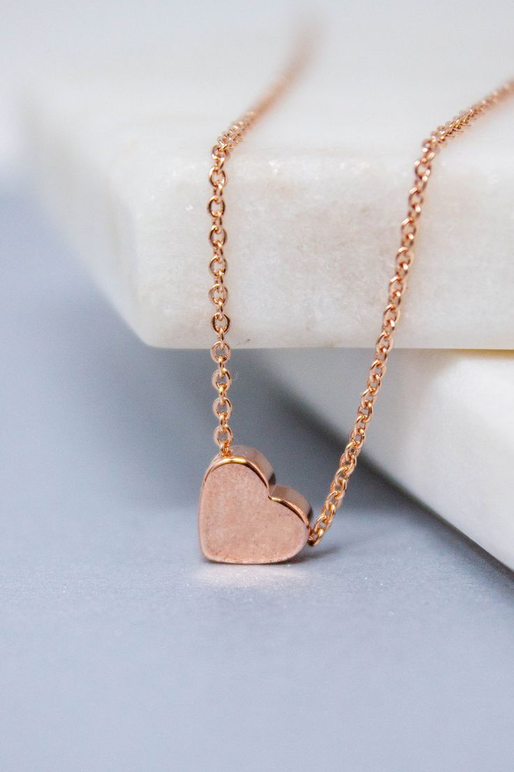 Dainty and stylish Rose gold small Heart charm necklace is great to wear for everyday or special occasions Available in rose gold SIZE ♥ Chain Length : 16.5 '' ( as pictured ) Please you can CHOOSE your chain length( 15 inches - 18 inches ) before purchasing this item ! * necklace sizes * 15 inches: around neck 16 inches: standard short 17 inches: average length 18 inches: standard long SHIPPING TIME Fast shipping within 1 - 3 days **Your order will be ready to be shipped within 3 business days Rose Gold Heart Pendant Necklace With Clavicle Chain, Rose Gold Double Heart Necklace With Delicate Chain, Everyday Rose Gold Charm Necklace For Valentine's Day, Delicate Rose Gold Heart Charm Necklace, Personalized Rose Gold Heart Necklace For Her, Delicate Rose Gold Heart Necklace For Mother's Day, Personalized Minimalist Rose Gold Heart Necklace, Rose Gold Charm Necklace With Heart Pendant, Rose Gold Heart Pendant Charm Necklace With Delicate Chain