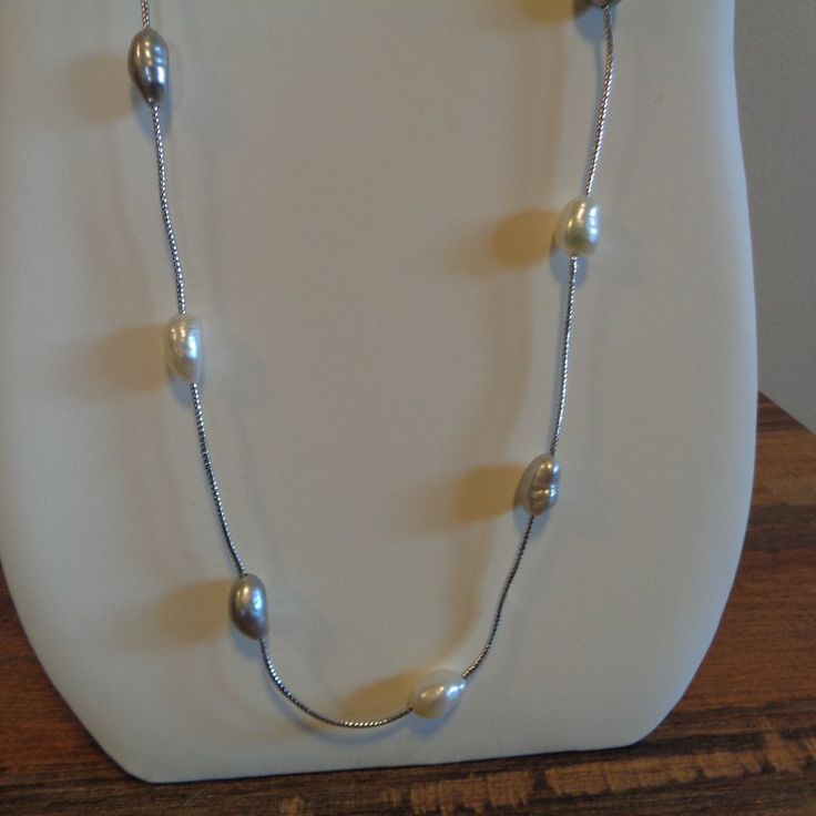 Hello. This Is A Beautiful Freshwater Pearl Station Necklace That I Got Many, Many Years Ago And Never Wore. This Is Not Sterling Silver. It Is 30" Long And Does Not Have A Clasp So It's A Put Over Your Head Necklace. The Freshwater Pearls Are Alternating With Natural Pearl Color And A Dove Gray Color. There Are 16 Pearls In All And Each Pearl Measures About 1/2" In Length And 1/4" In Width. This Varies A Bit Because They Are Natural. They Have Beautiful Luster, And The Silver Chain Is Bright. L Silver Metal Pearl Necklace For Formal Occasions, Adjustable Silver Long Necklace For Formal Occasions, Silver Long Necklace With Pearl Chain, Silver Metal Chain Necklace For Anniversary, Adjustable Silver Long Pearl Necklace, Adjustable Long Silver Pearl Necklace, Adjustable Sterling Silver Pearl Necklace In Silver, Adjustable Silver Single Strand Pearl Necklace, Sterling Silver Single Strand Chain Necklace