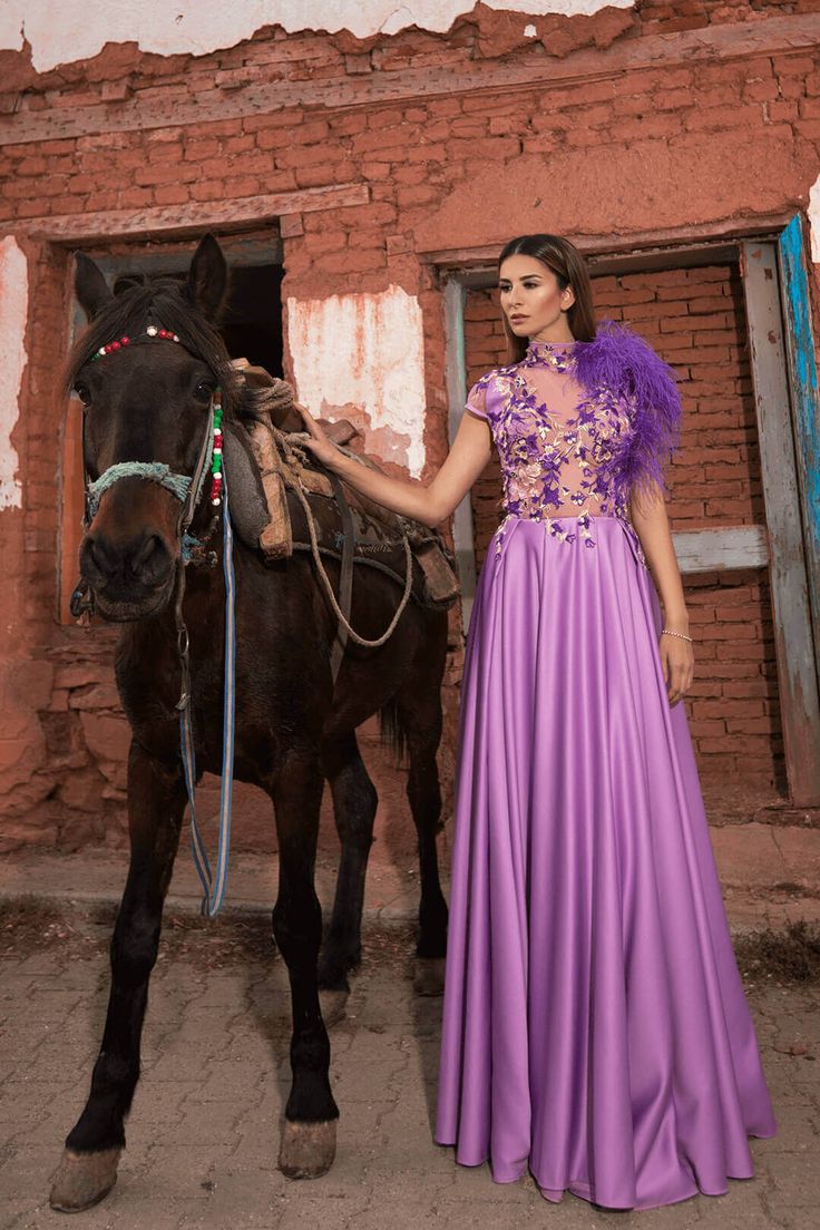 Representing delicacy and softness, this dress enriches every woman’s beauty and experience. A line shape violet dress containing handmade embroideries different kinds of flowers, leaves with some feathers on one shoulder! Floral Embellished Dresses For Gala, One-shoulder Feather Trim Dress, One-shoulder Dress With Feather Trim, One Shoulder Dress With Feather Trim, Lavender Evening Dress For Wedding, Gala Dress With Feather Trim And Fitted Bodice, Formal Dress With Feathers And Fitted Bodice, Purple One-shoulder Gala Dress, Purple One-shoulder Dress For Gala