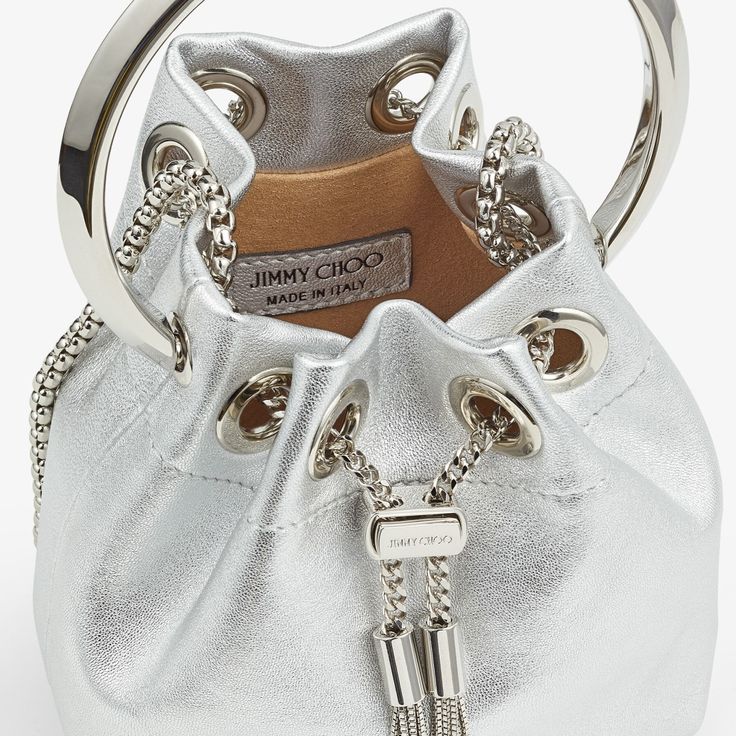 Silver Metallic Nappa Mini Bag | MICRO BON BON | Summer 2022 collection | JIMMY CHOO Leather Evening Bag With Silver-tone Hardware For Party, Modern Crossbody Bucket Bag For Party, Luxury Silver Bucket Bag For Party, Chic Party Bucket Bag With Silver-tone Hardware, Elegant Evening Bucket Bag With Silver-tone Hardware, Party Shoulder Bag With Silver-tone Hardware, Bucket Shape, Luxury Bucket Bag For Party, Luxury Silver Bucket Bag For Evening, Modern Evening Bucket Bag With Branded Hardware