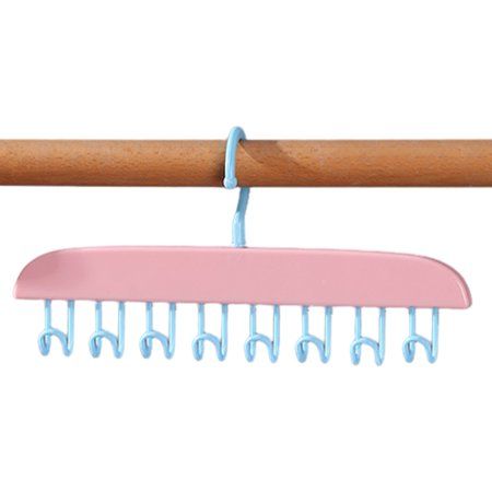 a pink and blue comb hanging from a wooden handle