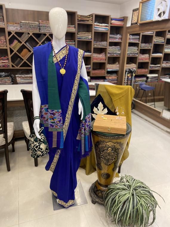 A Marvellous Embroidered Kashmiri Saree, which you can wear at any party or a wedding.- - - - - - - - - - - - - - - - - - - - Product Details- Condition: Brand New- Style: Saree- Embroidery: Kashmiri Tilla Embroidery- Base Colour: Royal Blue- Embroidery Colour: Golden - Care Instructions: Dry Clean OnlyF A B R I CSaree: Pure CrepeBlouse: Pure CrepeF I N I S H- UnstitchedYou can get it stitched locally.- StitchedWant your blouse ready to wear, let us know the style you want and we will stitch it Elegant Blue Embroidered Fabric For Navratri, Blue Embroidered Saree For Party, Blue Embroidered Saree Dress, Embroidered Blue Saree Dress, Fitted Traditional Wear With Embroidered Border For Party, Blue Designer Dress For Transitional Season, Party Blue Embroidered Saree, Party Embroidered Blue Saree, Blue Embroidered Anarkali Fabric For Festive