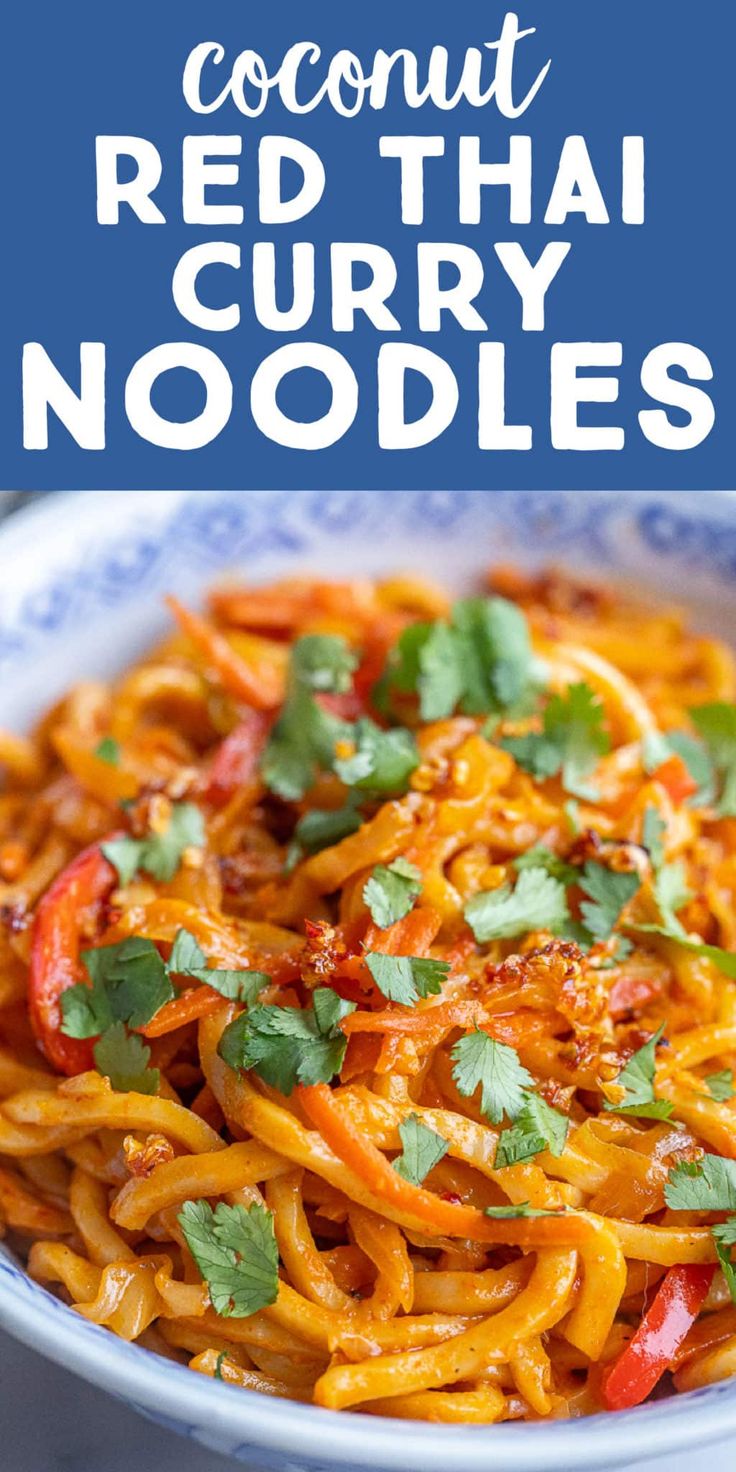 a white bowl filled with red thai noodles and garnished with cilantro