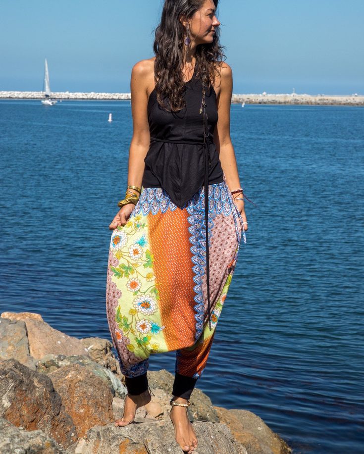 "Beautiful Handmade pair of harem pants for both men and women. Wonderful yoga or lounge wear outfit. Ethically made using soft Upcycled material. -Unisex - Stretch - Flowing relaxed fit - 2 side pockets + inner drawstring to secure the waist. Great for Yoga, Dance, Exercises, Meditations, Yoga Practice and beyond... Materials: black color cotton jersey combined with an upcycled colorfully printed light jersey fabric. Fabrics for this pair were bought in Fashion Districts in NY and LA and the pa Cotton Hippie Harem Pants For Meditation, Hippie Cotton Harem Pants For Meditation, Summer Yoga Baggy Harem Pants, Baggy Harem Yoga Pants For Spring, Hippie Harem Pants For Spring Loungewear, Casual Harem Pants For Festivals, Casual Festival Harem Pants, Hippie Cotton Harem Yoga Pants, Bohemian Harem Pants For Summer Loungewear