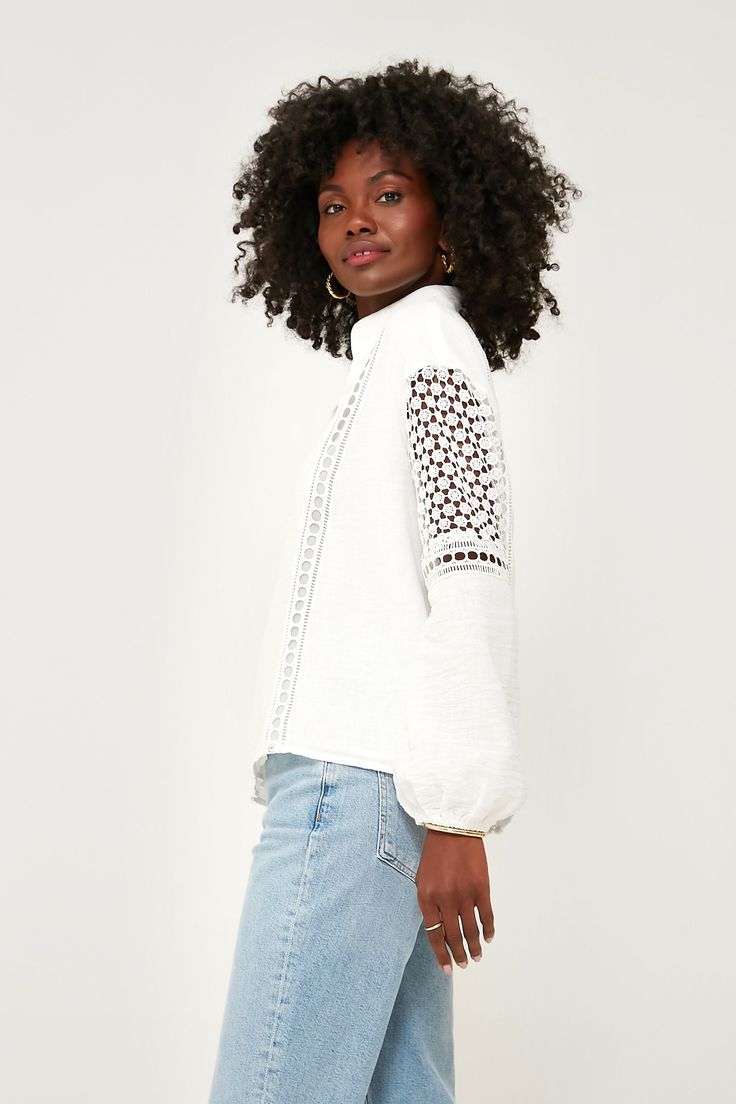 Extra cute thanks to the lace and eyelet detailing, the Jane Blouse will be playing on repeat in our closets this summer. With long blouson sleeves that feature delicately crafted cutouts and a relaxed, breezy fit that makes for effortless all day wear, you are sure to receive lots of compliments on this lightweight luxe style. A sweet way to dress up your most loved denim, from beach bonfires to al fresco spritzes with the gals, there's no wrong way to style this refreshingly chic top. Stand co Casual White Blouse With Lace Sleeves, White Lace Sleeve Blouse For Spring, Long Sleeve Pointelle Crochet Top For Day Out, White Blouse With Lace Sleeves For Spring, White Lace Sleeves Blouse For Spring, Long Sleeve Pointelle Knit Crochet Top For Day Out, Casual Broderie Anglaise Top For Fall, Fall Casual Broderie Anglaise Top, Long Sleeve Crochet Top For Spring