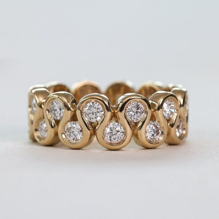 an image of a gold ring with diamonds