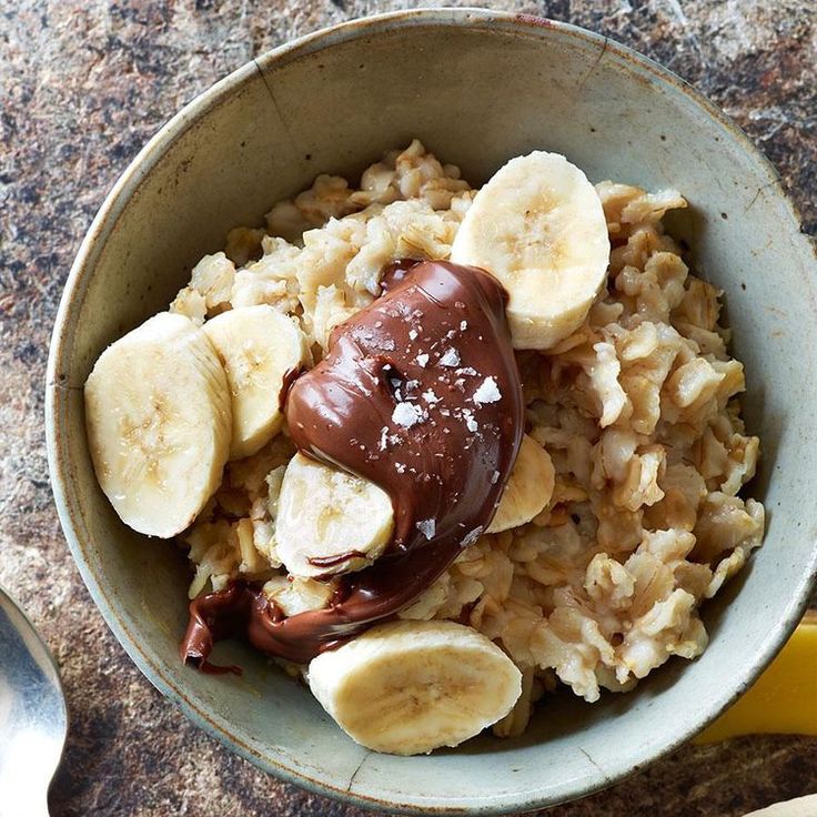 a bowl of oatmeal with bananas and chocolate