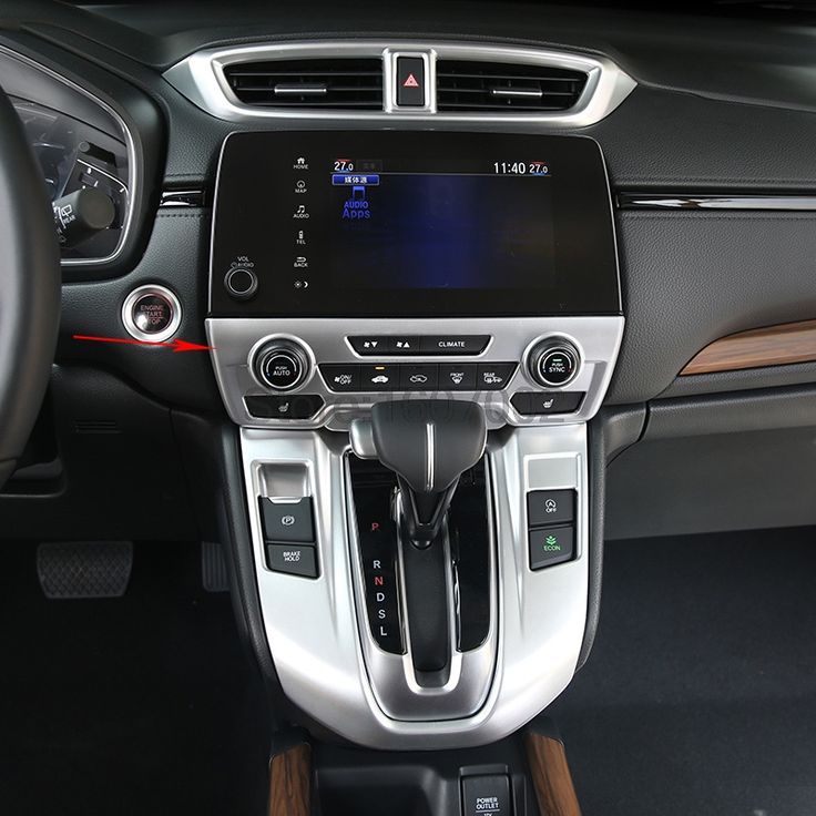 the interior of a car with an electronic display and steering wheel controls, dashboard lights, and dash board