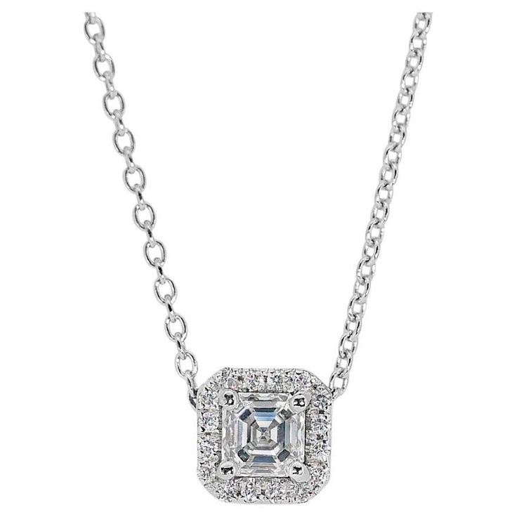 Brilliant 18k White Gold Natural Diamond Halo Necklace w/0.91 ct - GIA Certified Embrace timeless elegance with this brilliant diamond halo pendant necklace, meticulously crafted in stunning 18k white gold. At the heart of the ring lies a brilliant square-cut diamond with 0.80 carat and encircling the magnificent center stone are 16 sparkling diamonds with a total of 0.11 carat weight. GIA Certified for authenticity and excellent quality. Metal: 18k White Gold Main stone: 1 pc Diamond Main stone carat weight: 0.80 ct Shape: Square Color grade: D Clarity grade: VVS1 Side stone: 16 pcs Diamonds Side stone carat weight: 0.11 ct Shape: Round Color grade: E-F Clarity grade: VS Total carat weight: 0.91 ct Total jewelry weight: 2.83 g Certificate Number: GIA 6472769054 Size: Chain Length: 42 cm S Classic Diamond Necklace With Halo Detail, Classic Diamond Halo Necklace, Formal Diamond Necklace With Halo, Formal Diamond Halo Necklace, Classic Diamond Pendant Necklace With Halo, Formal Silver Diamond Necklace With Halo, Formal Silver Halo Diamond Necklace, Formal Halo Cubic Zirconia Diamond Necklace, Formal Fine Jewelry Diamond Necklace With Halo