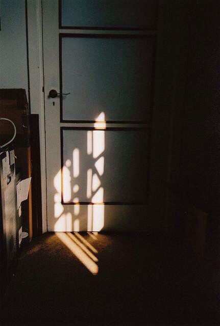 the door is open to let in light from the sun coming through it's window