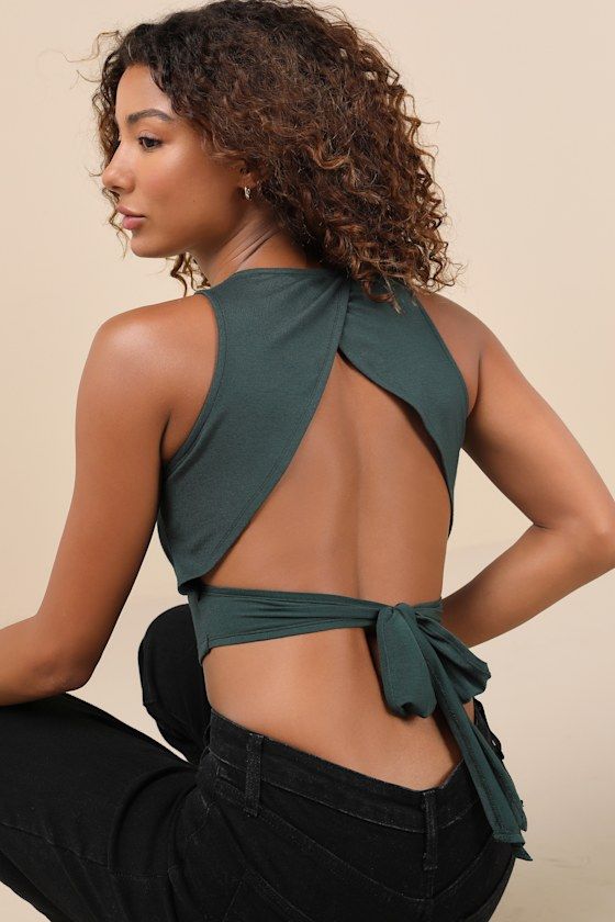 You'll never go back to basics again with the Lulus Let's Tie It Emerald Green Tie-Back Cropped Tank Top! Stretchy ponte knit fabric shapes this cute, everyday top with a crew neckline and a sleeveless, princess-seamed bodice with a cropped hem. Turn around to reveal an overlapping, cutout back with two long sashes that tie together for a flirty look! Fit: This garment fits true to size. Length: Size medium measures 16.5" from shoulder to hem. Bust: Great for any cup size. Waist: Fitted - stretc Basic Bodice, Orange Crop Top, Never Go Back, Hair Cover, Bridal Event, Green Tie, Back To Basics, Tank Top Cami, Cup Size