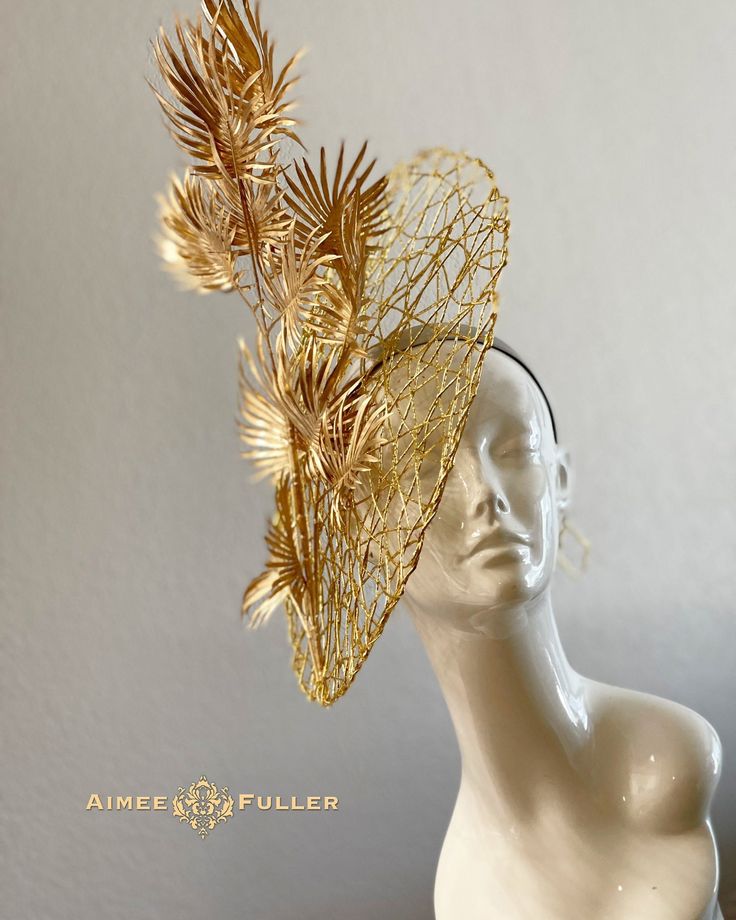 Aimee Fuller Kentucky Derby Fascinator Structured, chic crisscross woven material with layers of golden palm leaves / fronds. A wonderful tropical treat! Easy-to-wear headband fascinator makes a statement and can be worn to a myriad of events: Easter, Bridal, Derby-Wear, Del Mar Races, Hat Contests, Church, Gala, Kentucky Derby, Melbourne Cup, High Tea, Weddings, Cocktail Parties, Weddings, and More.  Some customizations available; please message with your requests to see if we can meet your needs. *FREE SHIPPING  For more STATEMENT JEWELRY and HANDMADE HATS go to www.aimeesfuller.com Aimee Fuller has been a trusted online seller since 1999, and is excited to bring her creations back to Etsy.  Though often copied by hobbyists and even high-end department stores, discriminating fashionistas Luxury Gold Fascinator For Parties, Luxury Gold Fascinator For Spring, Luxury Gold Fascinator For Formal Occasions, Luxury Gold Summer Fascinator, Luxury Gold Fascinator With Structured Crown, Luxury Gold Spring Fascinator, Luxury Gold Headpiece For Races, Handmade Gold Hat For Kentucky Derby, Chic Fitted Costume Hat With Structured Crown