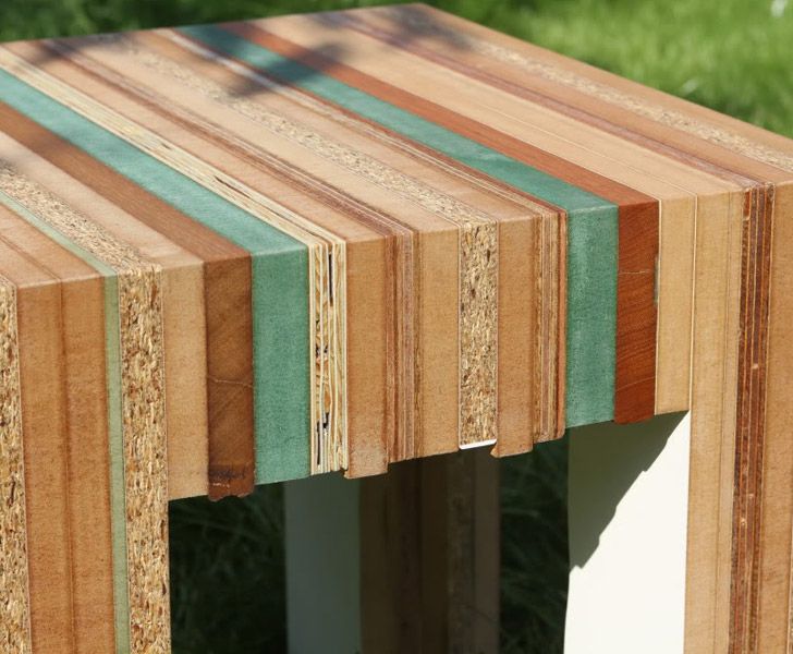 a close up of a wooden table with different colored strips on the top and bottom