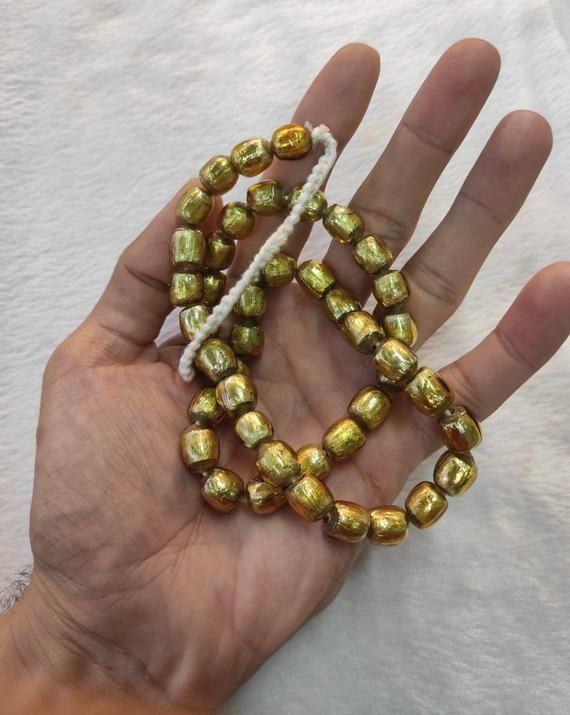 It's Very Beautiful Ancient Unique Color Patina Roman Glass Beads Necklace From 3rd Century Beads NecklaceMaterial Roman GlassHistory 3rd CenturyLength 60cm Traditional Gold Beaded Bracelets For Jewelry Making, Traditional Gold Beaded Necklace With Spacer Beads, Adjustable Gold Traditional Beads, Traditional Gold Beaded Bracelets With Polished Beads, Spiritual Mala With Round Beads For Celebration, Festive Gold Beaded Necklaces With Spacer Beads, Festive Gold Polished Beaded Bracelets, Spiritual Gold Beaded Bracelets With Large Beads, Festive Adjustable Hand-strung Necklaces