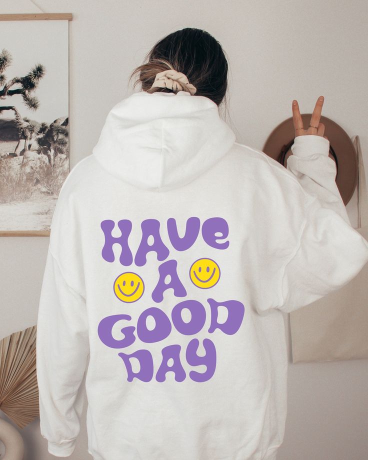 Have A Good Day Sweatshirt, Smiley Face Sweater, Positive Quote Hoodie, Good Energy Sweater, Aesthetic Hoodie, Words On Back Sweatshirt Hi all, welcome to the Comfy Tee Design, It's so nice to see you here. If you are looking for soft, comfy and high quality sweatshirts, I have good news for you: You're at the right place!  Sweatshirts are unisex sizing. It's proper, comfortable and flattering for men and women, but may run  large for the ladies. Please see the size chart to find your perfect fi White Hoodie With Letter Print For Loungewear, White Long Sleeve Hoodie With Lettering, White Hoodie With Lettering For Fall, Trendy Cotton Hoodie With Lettering, White Hoodie With Lettering In Relaxed Fit, White Hooded Hoodie With Lettering, Trendy Crew Neck Hoodie With Lettering, Casual White Hoodie With Lettering, Cotton Hoodie With Lettering