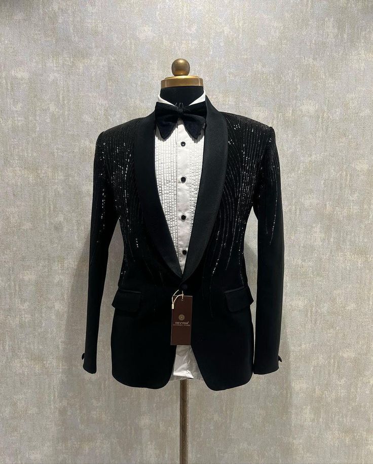 *2 Piece Black , Pant, Shirt Blazer and Bow  *Fabric: %100 Japanese , Cotton, Thick, Warm, Comfortable, Breathable, Softer, Satin Feeling *Center 1 Button Blazer ,With Zipper Fly Pants. *This Suit Has A 6" Drop Which Is The Difference Between The Size Of The Sherwani & Pants. For Example, A 40r Jacket Includes A 34W Pant *Dry Clean Only Important Note: All Our Products Are Made To Order ! Please Contact Us For Perfect Fitting Suit. .Full Lining Tuxedo Suit With Padding *We are proud to offer a w Trending Tuxedos For Men, Tailored Long Sleeve Sets For Groom, Fitted Long Sleeve Tuxedo For Black Tie Events, Fitted Long Sleeve Suit For Black Tie Events, Fitted Long Sleeve Suits For Groom, Groom's Long Sleeve Tuxedo Set, Slim Fit Long Sleeve Suits For Wedding, Slim Fit Tuxedo For Wedding, Long Sleeve Tuxedo Suit For Groom