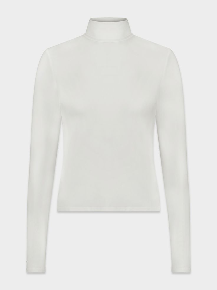 The Modal Turtleneck is the perfect winter layering piece. The beautiful shade of cream makes this the perfect addition to any outfit! Off White Stretch Top For Fall, Classic Neutral Tops For Winter, Classic Turtleneck Top In Winter White, Classic Neutral Tops For Layering, Stretch Off White Top For Fall, Casual White Spring Turtleneck, Casual White Turtleneck For Spring, Chic White Long Sleeve Turtleneck, Elegant Neutral Tops For Winter