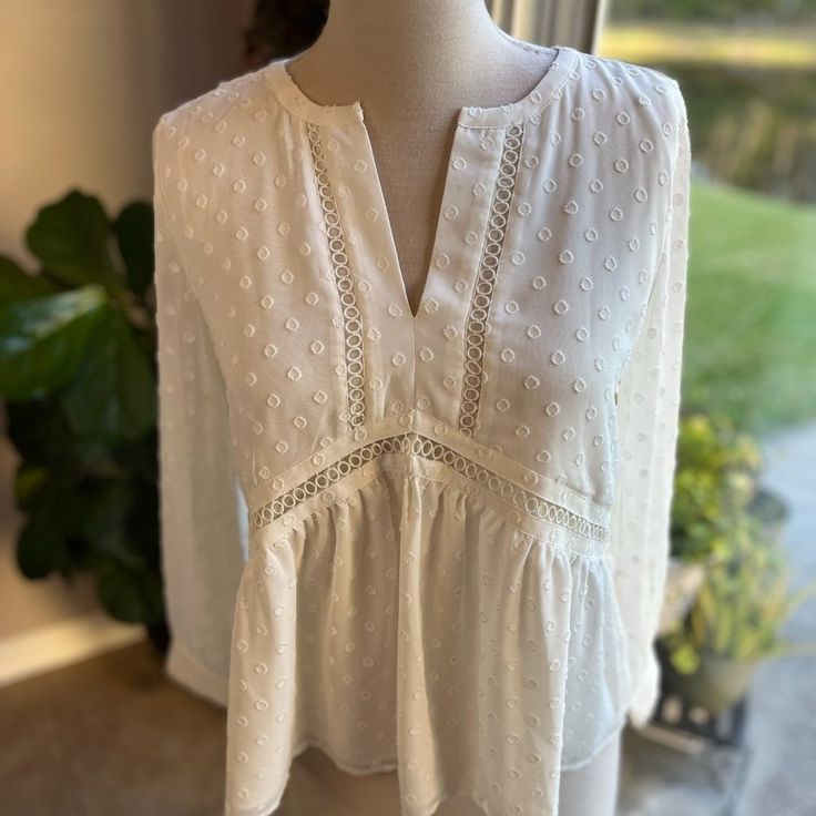 Loft Boho Tunic Sheer Blouse Long Sleeves Ecru White Eyelet Accents V Neck In Size Xs. New With Tags Originally At $59.50. Color May Vary In Pictures Due To Lighting. Approximate Measurements: Pit To Pit: 37 Inches (18.5 X 2) Shoulder To Hem: 23 Inches Sleeves: 21 Inches Box#2 Off White V-neck Top For Daywear, Off White V-neck Blouse For Day Out, Spring Cream Top For Workwear, Cream Tops For Spring Workwear, Spring Workwear Cream Top, Cream Top For Workwear In Spring, Chic Off White V-neck Top, Off White V-neck Top With Lace Trim, Off White Fitted Lace Top Blouse