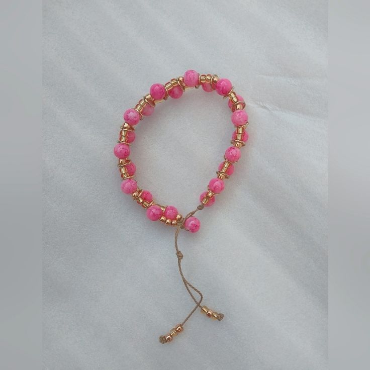 Glass Bead Bracelet Pink And Gold Glass Beads With Gold Metal Accents Bamboo Cord Adjustable Onesize Fits Most Handmade With Love Adjustable Pink Rosary Bracelet With 8mm Beads, Adjustable Pink Beaded Bracelets With 8mm Beads, Adjustable Handmade Pink Rosary Bracelet, Pink Friendship Bracelets With 8mm Round Beads, Pink Beaded Rosary Bracelet With Round Beads, Pink Beaded Rosary Bracelet, Pink Adjustable Crystal Bracelet With Round Beads, Adjustable Stretch Bracelet With Gold Round Beads, Adjustable Pink Crystal Bracelet With Round Beads