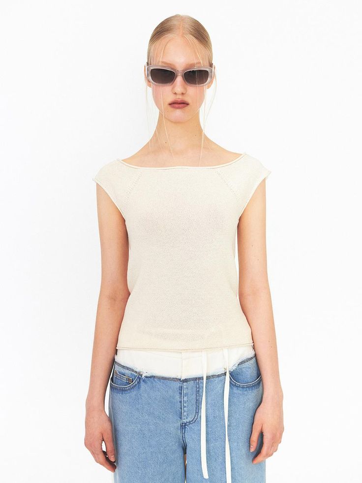 This is a modern and casual knit top by DIAGONAL that is made out of high quality and sturdy fabric. With unique design detail and trendy mood, you can style it for your clean and casual daily outfit.- Comfortable wear with no seams- Cap sleeves detail- Narrowing knit detail for natural curve of armhole Stretch Knit Top In Cream, Stretch Knit Cream Tops, Textured Knit Tops For Spring, Textured Knit Tops For Everyday Spring Wear, Chic Tops With Ribbed Neckline And Relaxed Fit, Cream Stretch Knit Top, Chic Relaxed Fit Top With Ribbed Neckline, Chic Relaxed Fit Knit Top For Everyday, Spring Beige Tops With Ribbed Neckline