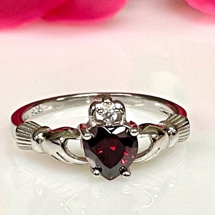 925 Sterling Silver Claddagh Irish Garnet Cz Ring * Metal :925 Sterling Silver * Stone :Grade Aaa Cubic Zirconia *Shape Heart 6mm *Design :Claddagh Irish Promise Rung * Color :White Gold Rhodium For Anti Tarnish. Irish Wedding Rings, Claddagh Ring Wedding, Dream Wedding Ring, Irish Rings, Garnet Heart, Irish Claddagh, Claddagh Ring, Vintage Sterling Silver Rings, Gothic Rings