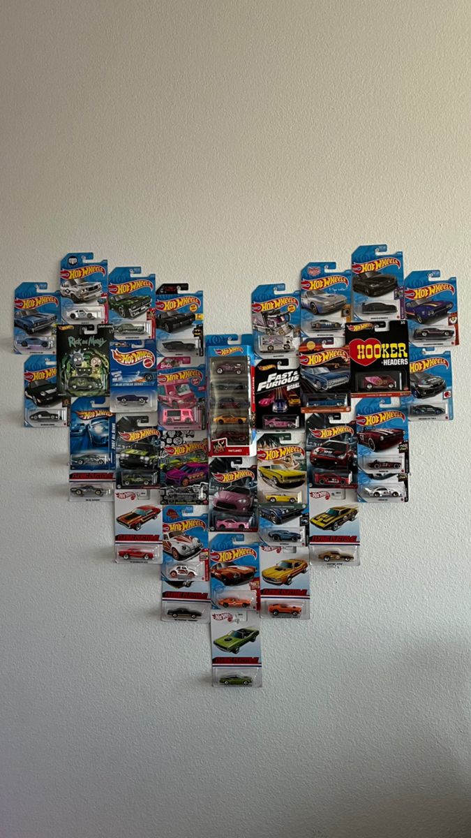 there are many hot wheels on the wall