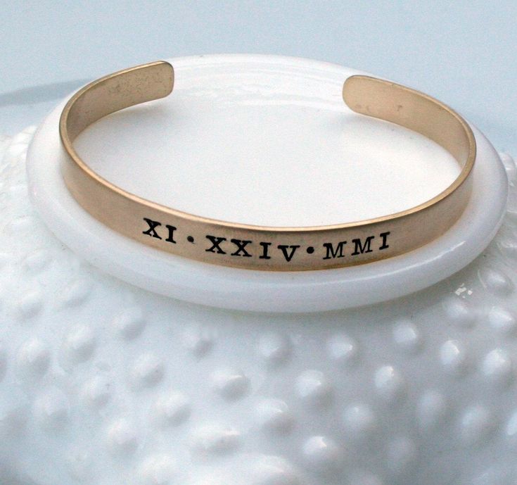 "CURRENT TURNAROUND TIME IS THREE (3) WEEKS ~Personalized Roman Numeral Cuff Bracelet - Special Date Bracelet - Engraved Custom Date Bracelet - Stacking Bracelet - Gift for Her '*.'*.'*.¸What You Will Receive ¸.*''.*''.*'' ❤ One (1) 1/4\" x 6\" brass cuff bracelet with brushed finish ❤ Items will be sent in clear cellophane bags. Boxes/gift packaging can be added at checkout for an additional fee. ❤ '*.'*.'*.¸What I Need To Complete Your Order ¸.*''.*''.*'' (enter the below info in the \"Note\" Adjustable Stackable Cuff Bracelet For Anniversary, Customizable Adjustable Vintage Jewelry, Adjustable Customizable Vintage Jewelry, Gold Stamped Cuff Bracelet For Anniversary, Adjustable Bangle Cuff Bracelet For Anniversary, Stackable Cuff Bangle As Gift, Gift Stackable Cuff Bangle, Adjustable Personalized Cuff Jewelry, Vintage Stackable Bangle As Gift