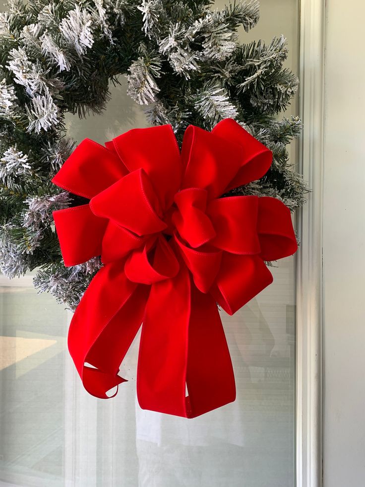 a christmas wreath hanging on the front door