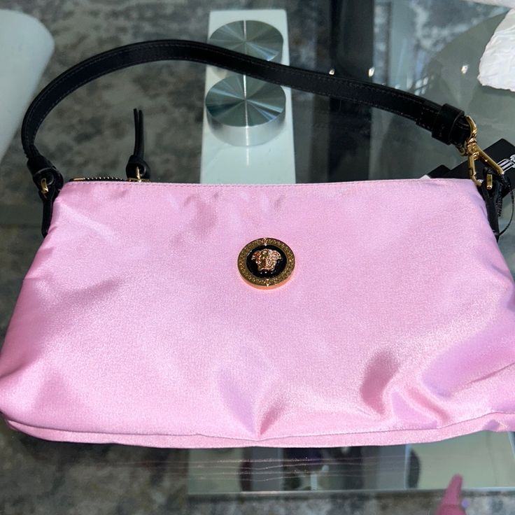 Versace Bag New With Dust Bag Pink Evening Shoulder Bag, Designer Pink Travel Pouch, Pink Shopping Bag With Zipper Pouch, Pink Shoulder Bag With Zipper Pouch, Designer Pink Pouch For Everyday Use, Pink Shoulder Bag With Gold-tone Hardware For Evening, Luxury Pink Shoulder Bag With Removable Pouch, Luxury Crossbody Shoulder Bag With Zipper Pouch, Designer Pink Shoulder Bag With Removable Pouch