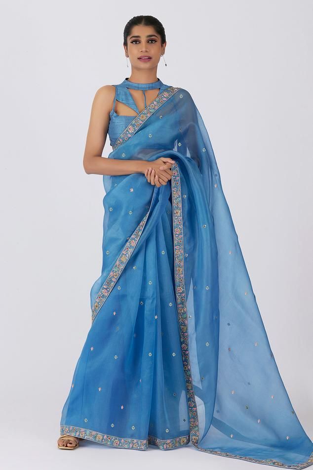 Sky blue saree with floral zardosi and sequin embroidery. Comes with unstitch blouse fabric.
Components: 2
Pattern: Embroidered
Type Of Work: Floral
Fabric: Silk Organza
Color: Blue
Other Details: 
Embroidered border
Note: The stitched blouse worn by the model is not for sale
Occasion: Puja - Aza Fashions Glitter Saree, Sky Blue Saree, Saree Draping, Embroidered Saree, Embroidered Border, Desi Style, Sequin Embroidery, Blue Saree, Saree Trends