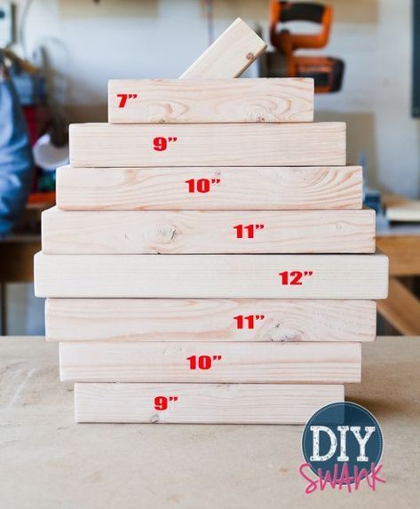 a stack of wooden rulers sitting on top of a table