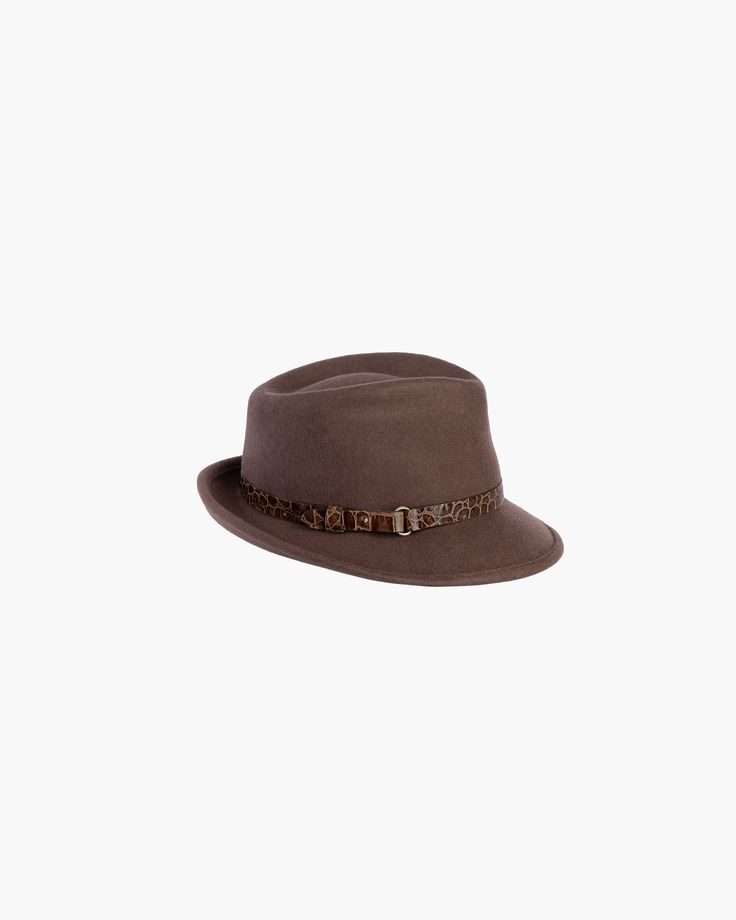 This water-repellent wool felt fedora is perfect for those who don't want too much hat. The abbreviated brim looks snappy and is reminiscent of mannish hats from 1950's. This wardrobe staple has an adjustable band of embossed calf leather with antique hardware. Crown is lined. Elasticized inner band fits most. Imported. Brim Span: 2.5" Art Costume, Band Fits, Felt Fedora, Women's Headwear, Antique Hardware, Costume Institute, Fedora Hat, Leather Accessories, Vanity Fair