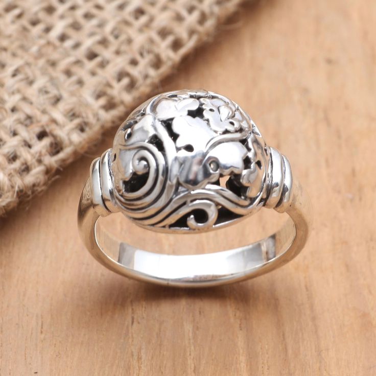 Elegance is at your fingertips when you wear this simple yet stunning ring from Dewa Arimbawa. Crafted from polished sterling silver the ring features a large dome engraved with leaves and traditional Balinese engravings that give the ring an exquisite touch. Silver Wrap Ring, Wax Carving, Purse Jewelry, Silver Feather, Wrap Rings, Jewelry Packaging, Artisan Craft, Contemporary Jewelry, Jewelry Gift Box