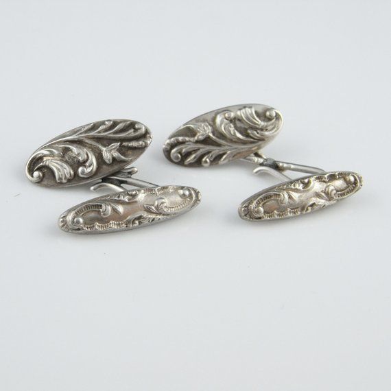 An elegant pair of original antique circa 1910 belle epoque sterling silver handmade repousse design double sided cufflinks.These fantastic cufflinks are an original belle epoque pair and not a reproduction. They are in excellent condition ready to wear. I adore the floriate but masculine design which is so timeless and is still so fashionable today. Today it would take several days work to work the fine silver entirely by hand using the repousse technique and hand engraving to make this amazing Luxury Vintage Formal Cufflinks, Luxury Antique Cufflinks As Gift, Formal Silver Engraved Cufflinks, Elegant Engraved White Gold Cufflinks, Classic Sterling Silver Cufflinks For Wedding, Silver Screw Back Cufflinks For Anniversary, Antique Cufflinks For Formal Wear, Silver Screw Back Cufflinks For Wedding, Luxury Silver Hallmarked Cufflinks