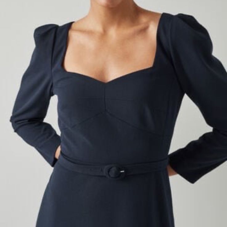 An Elegant Dress Perfect For Early-Season Occasions, Our Katerina Midi Dress Is Understated And Beautifully Cut. Crafted From Navy Stretch Crepe, It Has A Sweetheart Neckline, Puff Shoulders, Bracelet-Length Sleeves, A Nipped Waist With A Buckle Belt, And A Midi Skirt. Wear It With Heels And A Clutch For The Dressier Moments In Your Diary. The Katerina Dress Is Crafted From Navy Blue Crepe. It Has A Sweetheart Neckline, Puff Shoulders, Bracelet-Length Sleeves, A Nipped Waist With A Buckle Belt And A Midi Skirt. Color: Blue Dress Length: Midi Sleeve Length: Long Sleeves Fabric: Polyester Model Height And Size: The Model Is 179 Cm / 5'9" And Is A Uk Size 8 Washing Instructions: Dry Clean Long Sleeve Dress With Fitted Bodice For Brunch, Navy Fitted Midi Dress, Navy Long Sleeve Fitted Maxi Dress, Navy Fitted Long Sleeve Maxi Dress, Fitted Navy Long Sleeve Maxi Dress, Fitted Long Sleeve Navy Maxi Dress, Formal Blue Square Neck Dress, Blue Midi Dress With Square Neck And Fitted Bodice, Workwear Dresses With Fitted Bodice And Square Neck