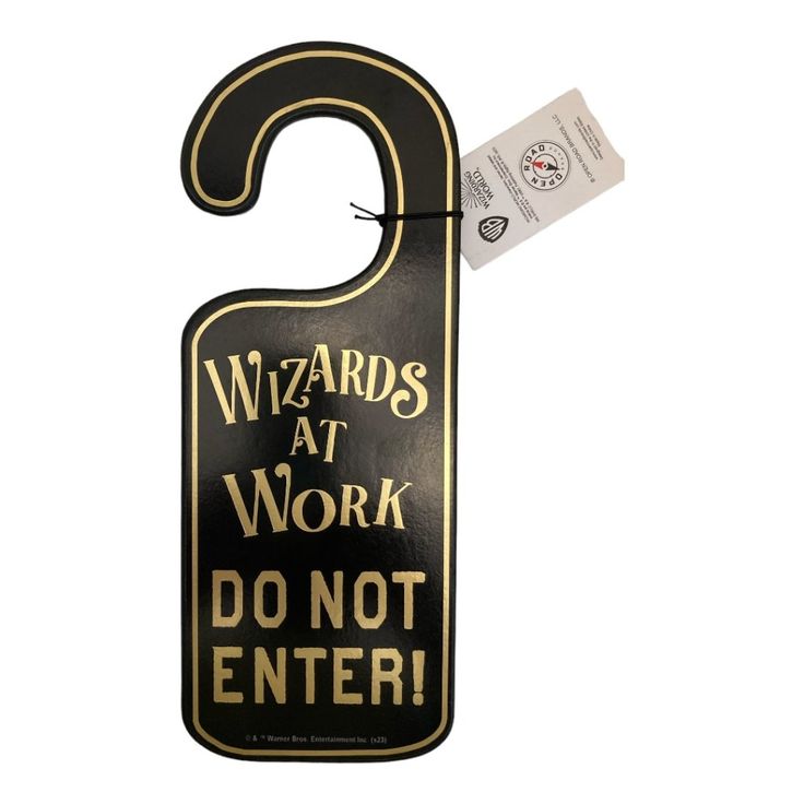 a black and gold door hanger that says wizards at work do not enter on it