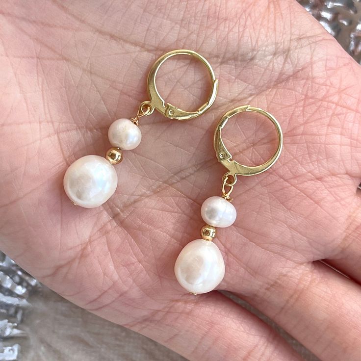 Classic dainty real natural pearl dangle earrings with gold hoop clip-on huggies. 7mm and 5mm ivory freshwater pearls have beautiful natural shine, every pearl is unique in its texture and shape, super elegant and classic. Great accessory for bridal bridesmaid wedding earrings, amazing gift idea for your loved one, they also look perfect with everyday outfit! 💎 Features: ♥ Material:14K Gold plated sterling silver, brass ♥ Main stone: 5mm, 7mm natural freshwater pearl, each pearl is unique ♥ Clip-on Closure 💎 Details: ♥ Approximate Measurements: - Length: 3.4 cm - Width: 1 cm ♥ Lightweight, easy to wear ♥ Nickel/Lead Free, Hypoallergenic, good for sensitive skins 🎁 Packing & Shipping: ♥ All our jewelry will be shipped with beautiful gift wrap packaging ♥ Handwrite gift notes/cards availa Dangle Pearl Drop Earrings, Gold Round Pearl Drop Clip-on Earrings, Gold Round Clip-on Earrings With Pearl Drop, Gold Hoop Earrings With Pearl Chain For Wedding, Wedding Gold Hoop Earrings With Pearl Chain, Pearl Drop Earrings With Pearl Charm, White Pearl Dangle Clip-on Earrings, White Dangle Pearl Clip-on Earrings, Delicate Pearl Dangle Earrings