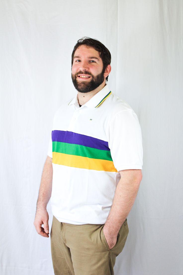 Celebrate Mardi Gras with this stylish white short sleeved Mardi Gras shirt. This shirt features purple, green and gold solid stripes across the chest. Small lines of purple, green and gold are around the collar. Green Short Sleeve Polo Shirt With Striped Collar, Green Polo Shirt With Striped Collar And Short Sleeves, White Polo Shirt With Contrast Stripes For Spring, White Collared Shirt With Contrast Stripes, Classic Purple Short Sleeve Polo Shirt, White Chest, Mardi Gras Shirt, Comedy And Tragedy, Polo Shirt Dress