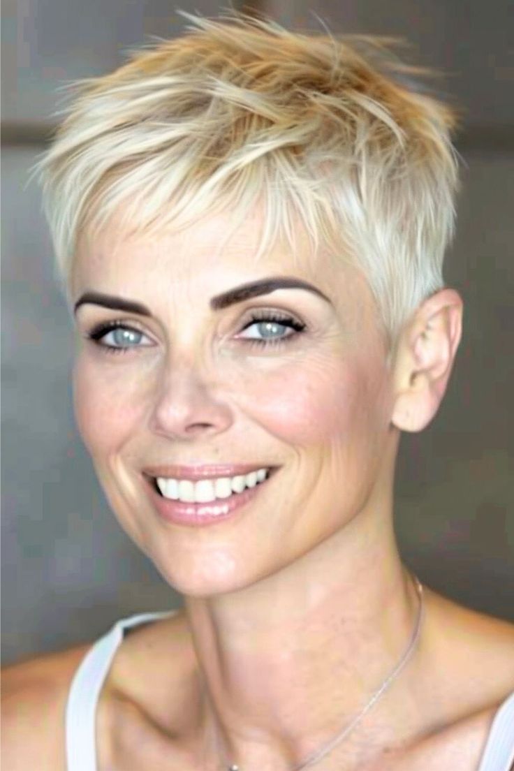 This cropped pixie cut is the epitome of edgy sophistication with its choppy layers that add volume and texture to fine hair.  Click here to see more stunning short hairstyles for women over 50 with fine hair. Pixie Haircut Fine Hair, Short Spiked Hair, Short Hairstyles Fine, Crop Hair, Very Short Haircuts, Twitter Artist, Short Hair Pixie Cuts, Messy Short Hair, Super Short Hair