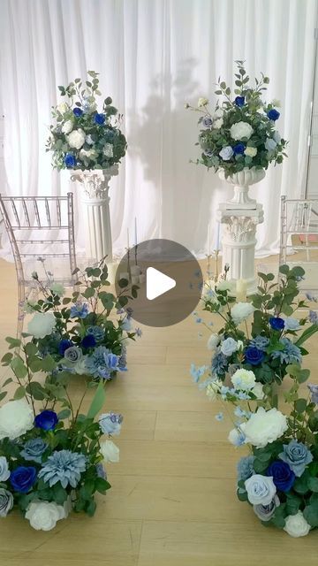 several vases filled with blue and white flowers