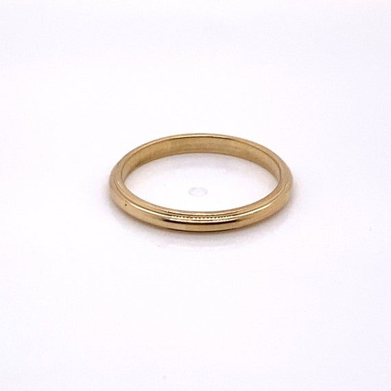 Vintage 1940's 14k yellow gold plain ridge band with Jabel trademark. The band is a size 7. The width of the band is 2.3mm. The height of the ring off the finger is 1.5mm. Heirloom Yellow Gold Bands With Decorative Details, 14k Yellow Gold Dome Ring, Heirloom 14k Gold Open Band, Classic Rings With Decorative Open Band, Classic Formal Engraved Ring With Polished Edges, Heirloom 14k Gold Wedding Band Thick Shape, Heirloom Yellow Gold Thick Band, Heirloom Thick Band In Yellow Gold, Classic Signet Ring With Polished Edges