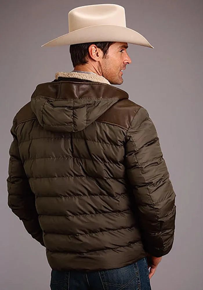 Genuine Leather Front with Zipper Sherpa Lining 2 Zippered Pockets in Front Leather Straight Frt & Back Yokes Quilted Nylon Back Body Quilted Nylon Sleeves with Rib Cuffs Stay warm and stylish in this handsome hooded jacket from Stetson, designed for the modern cowboy with a taste for casual elegance. Presenting the Stetson Novelty Solid Hooded Jacket in rich brown, a versatile piece that effortlessly merges rugged appeal with refined charm. Crafted from genuine leather, the front zipper closure ensures a snug fit, enveloping you in the luxurious feel of quality craftsmanship. The interior is lined with Sherpa, providing not just warmth but also unmatched comfort, making it your go-to choice on chilly ranch mornings or breezy evenings out on the town. Practicality meets sophistication with Brown Down Outerwear For Fall, Brown Outerwear With Detachable Hood For Cold Weather, Fitted Brown Outerwear For Outdoor, Khaki Winter Outerwear With Zip Fly, Brown Hooded Sport Coat With Pockets, Winter Brown Sport Coat With Padded Collar, Brown Down Outerwear For Outdoor, Casual Brown Nylon Outerwear, Fitted Brown Outerwear With Fleece Lining