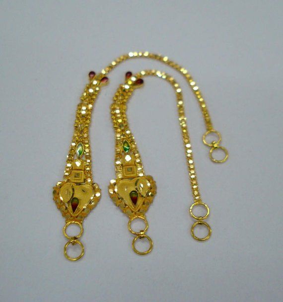 20kt gold ear chain pair from rajasthan india. great handmade design made of 20kt yellow gold adorn with meena colours. nice piece good for jewellery collection.Note - This chain can be wear with any earrings.Length max.- 12.8 cm(5")Width max.- 13.6 mmWeight - 6.860 gramsMaterial - 20kt yellow gold. Yellow Gold Meenakari Jewelry For Puja, 22k Gold Meenakari Jewelry For Puja, Festive 22k Gold Yellow Jewelry, 22k Gold Tilla Jewelry For Puja, 22k Yellow Gold Kundan Necklace For Puja, Gold Jewelry With Meenakari For Puja, Yellow Gold Kundan Jewelry For Puja, 22k Gold Bollywood Jewelry With Latkans, Gold 22k Meenakari Kundan Necklace