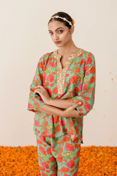 Welcome the new season with style and comfort, courtesy of our Green Floral Printed Muslin Co-Ord Set. Drawing inspiration from desi fashion, this chic set in a breezy green shade has all the makings of a luxurious outfit that will take you from brunch dates with friends to a day of shopping in total comfort. Crafted in muslin fabric, it'll be your go-to pick for effortlessly fashionable looks. No. of pieces : 2 piece set Color : Green Fabric : Muslin Top Length : 26-28 inches Pant Length : 38 i Green Bollywood Style Sharara With Floral Print, Bollywood Style Green Floral Sharara, Green Long Sleeve Palazzo Set For Festive Occasion, Spring Green Sets With Gota Work, Spring Festive Sharara With Gota Work, Festive Green Palazzo Set With Straight Kurta, Bollywood Style Palazzo Set With Gota Work For Spring, Green Floral Print Sharara With Straight Kurta, Green Palazzo Set For Diwali Designer Wear