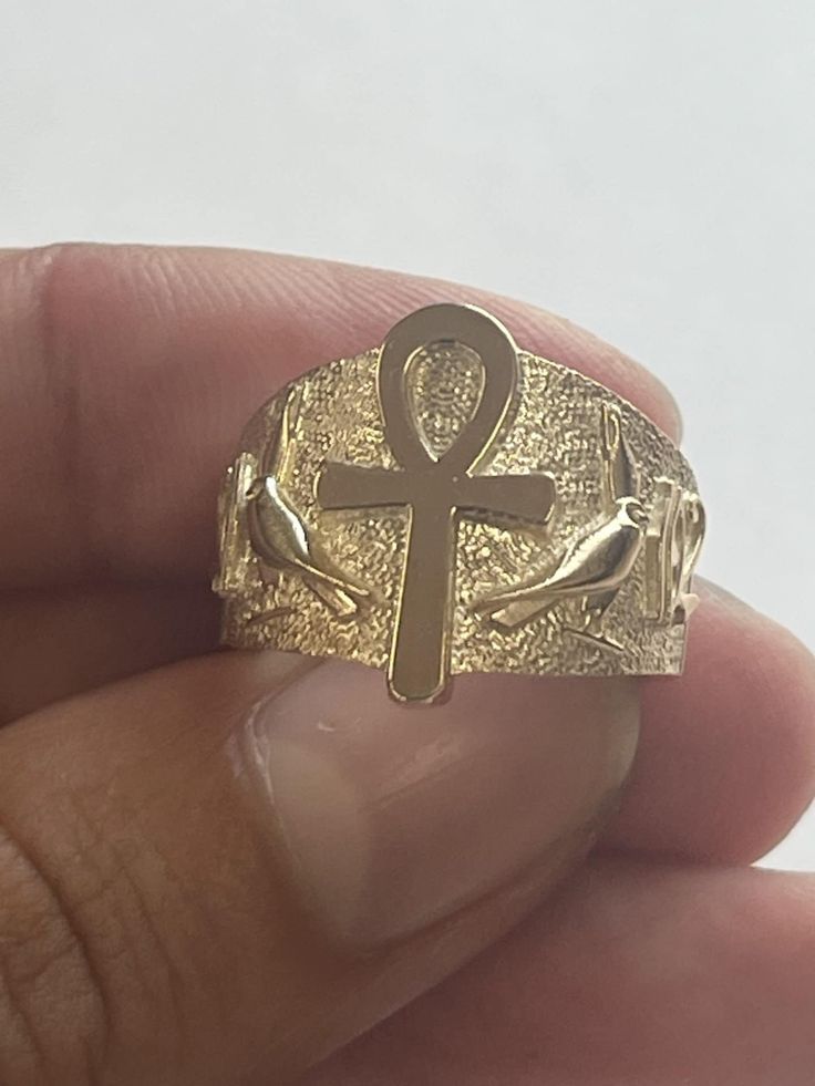 Excellent Quality. Very detailed. Comes with Certificate of authenticity    Material: Solid 10K or 14K Gold, stamped 10 or 14K Dimensions: 18 mm wide Ankh diameter size 7, proportional to ring size.  10K approximate weight 10-12 grams 14K approximate weight weight 14-16 grams 100% satisfaction Guaranteed. Returns accepted within 30 days. If you are unhappy with your purchase for any reason, please don't rush to give negative feedback, simply place the item back in its original box and send it ba Etched 14k Gold Rings, Spiritual Gold Etched Rings, Spiritual Etched Gold Rings, Symbolic Etched Yellow Gold Rings, Symbolic Engraved Gold Rings, Egypt Gods, Ancient Egypt Gods, Egyptian Ankh, Local Jewelry