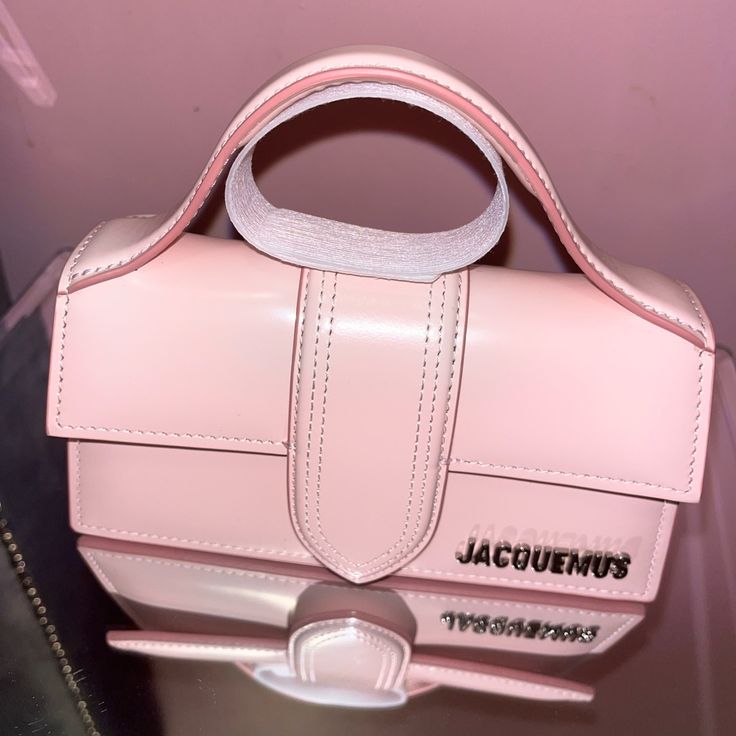 Pink Le Chouchou Le Bambino Bag Patent Calfskin Shoulder Bag In Pink Adjustable And Detachable Shoulder Strap H4 X W7 X D2.25 In Designer Pink Box Bag With Top Carry Handle, Pink Leather Box Bag With Dust Bag, Designer Pink Box Bag With Adjustable Strap, Luxury Pink Box Bag With Adjustable Strap, Designer Pink Crossbody Box Bag, Pink Jaquemus Bags, Jacquemus Le Chiquito Noeud Leather Shoulder Bag, Designer Pink Box Bag With Detachable Handle, Jaquemus2020 Bag