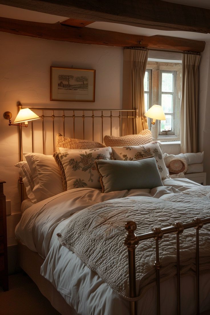 a bed with white sheets and pillows in a room