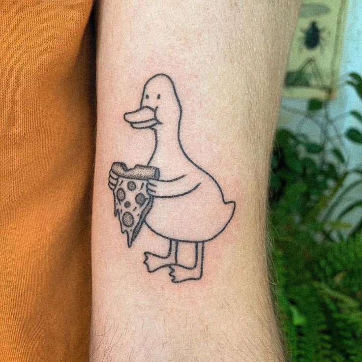 a duck with a slice of pizza tattoo on the left forearm and arm, holding a piece of pizza in its hand